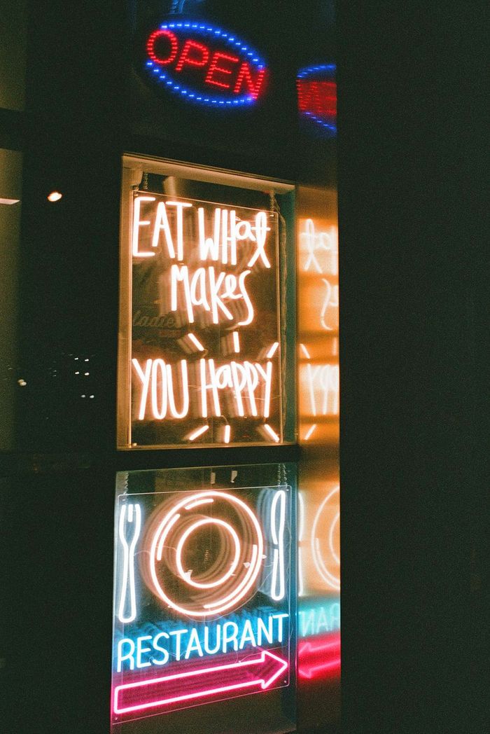 A neon restaurant sign at night
